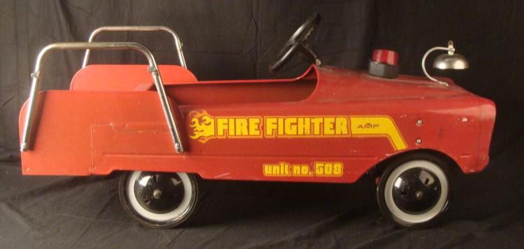 AMF Vintage Fire Fighter Engine Pedal Car Unit No. 508: Here is a vintage AMF Fire Fighter Pedal Car Unit No. 508. It has a sturdy metal construction, with chrome rails and bell, plastic steering wheel and hard rubber tires. The paint has some wear and ver