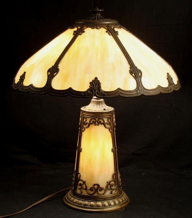 Antique Tan Table Lamp w/ Glass Shade & Lighted Base: This elegant lamp has yellow tan marbled glass on the shade, and on the base. The pierced ornamentation, and leaf and scalloped borders are dark brass tone metal. It uses three standard size bul