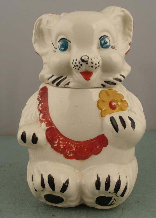 Royal Wear Vintage White Bear Cookie Jar Stoneware:  This big vintage White Bear Cookie Jar is ready to tempt you with its blue eyes, and charming flower. * * Condition: Good (there is a crack on the head, some glaze wear and minor crazing) Size o