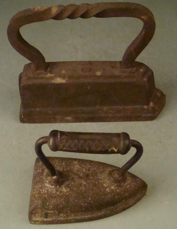 TWO ANTIQUE CAST IRON-LARGE FANCY 9" BASE & OTHER 6": TWO ANTIQUE CAST IRON-IRONS-LARGE FANCY 9" BASE & OTHER 6" * LARGER IRON HAS CURLED HANDLE AND IS MARKED "16"--HAS A 9" LONG BASE--OTHER SMALLER W/6" BASE *