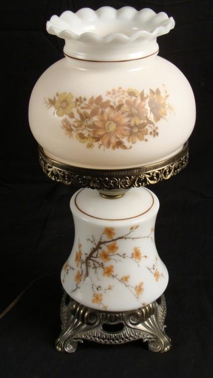 Vintage White Glass Lamp w/Flowers on Base & Shade: This white glass lamp has orange flowering branches, both on the base and on the shade. The decorative fittings and key-shaped switch are antique brass tone. This is a vintage lamp, and it will bring 