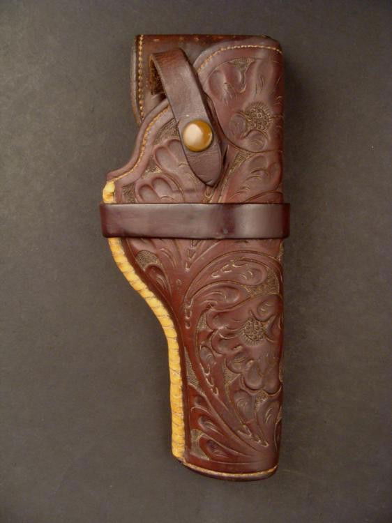 H. H. Heiser Antique Leather Police Gun Holster 1915: This is a leather field side gun holster made around 1915 by H.H. Heiser of Denver Colorado. It was made to carry a Colt Police gun, and can also fit a Smith & Wesson model 10. The hol