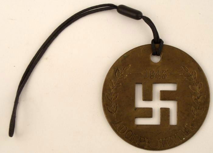 BRASS NAZI DISC-1 3/4" DIAM-ENGRAVED ADOLPH HITLER 1943: BRASS NAZI DISC-1 3/4" DIAM-ENGRAVED ADOLPH HITLER 1943-CUT-OUT SWASTIKA-POST PERIOD * INTERESTING PIECE OF POST WAR ART--HITLER'S FIRST NAME IS SPELLED ADOLF IN GERMAN *