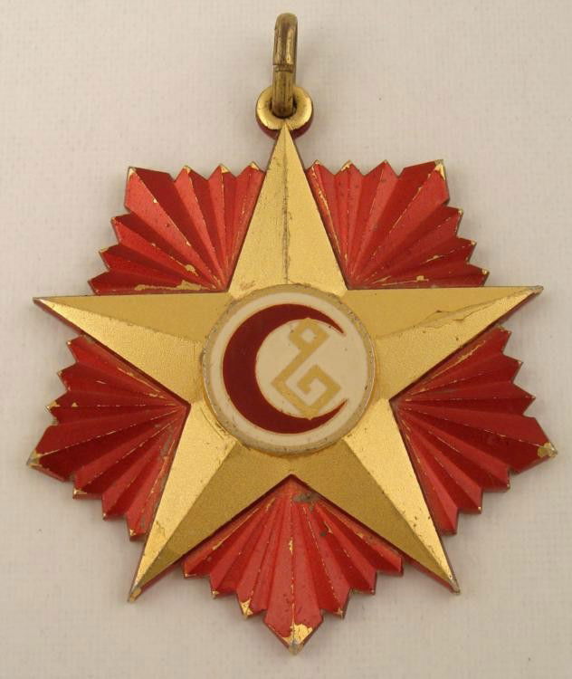 AFGHANISTAN WOUND BADGE AWARD MEDAL STAR 7 STARBURST: THIS IS AN AFGHANISTAN WOUND BADGE AWARD MEDAL. IT HAS A STAR 7 STARBURST WITH A CRESCENT MOON AND A SUSPENSION LOOP ON TOP.
