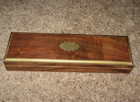 Dazzling Rosewood Jewelry Box with Brass Inlay and Bras: Dazzling Rosewood Jewelry Box with Brass Inlay and Brass Trim, Handmade Rosewood Jewelry Box that measures approx. 10in by 3in by 1 1/2in tall. There is a simple brass inlay in the top and brass trim 