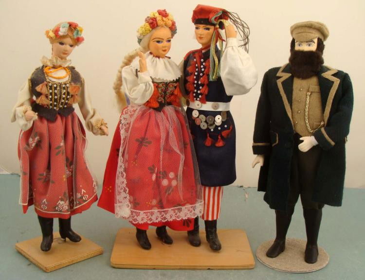 4 Vintage Costume Dolls Poland, Russia -Hand Made: Here are four vintage dolls showing traditional costumes and dress of their native countries. Two are from Poland, and go together. They stand 10" tall on the same wooden base. The bottom of the base