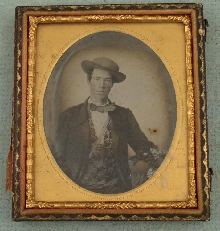 Antique Tintype Photo in Frame Man w/ Nice Vest: This is a Tintype portrait of a man wearing an ornately patterned vest. The photo has some fading around the edges. The glass has some sticker residue that should clean up fine. It comes in the back p