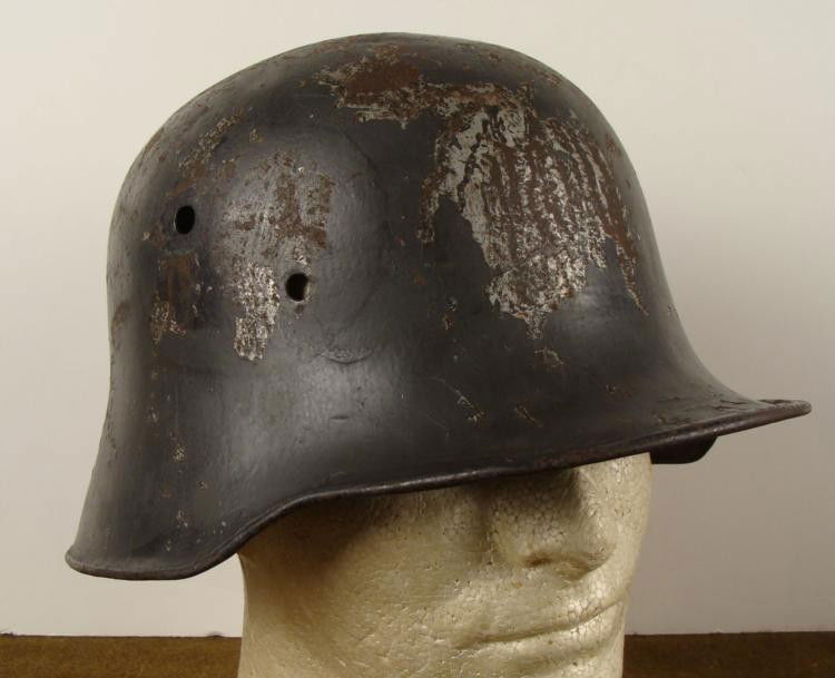 GERMAN WWI M18 COMBAT HELMET SHELL -ORIGINAL LARGE SIZE: GERMAN WWI M18 COMBAT HELMET SHELL-ORIGINAL * LARGE SIZE-SHOWS A GOOD DEAL OF COMBAT DAMAGE-SHELL ONLY-NICE DISPLAY HELMET *
