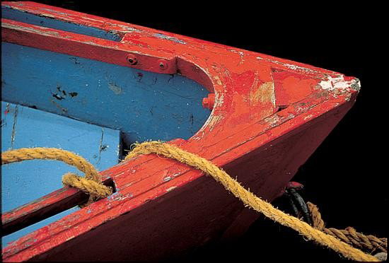 Primarily Red John Peer Art Print Dilapidated Boat: In this print, John Peer is depicting a dilapidating red boat. It has seen better days... This is an open edition print. It's image size is 9 1/2" x 6 1/4" and its paper size is 11 3/4" x&