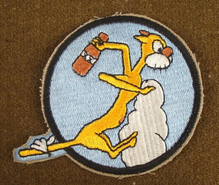 AIR SQUADRON MASCOT PATCH: OFFERED HERE IS AN AIR SQUADRON MASCOT PATCH. WE BELIEVE THAT THE PATCH WAS EITHER FROM WWII OR KOREA. IT IS EMBROIDERED WITH A 1/2 CAT, 1/2 DONKEY IN YELLOW, ON A CLOUD TOSSING A WHISKEY 