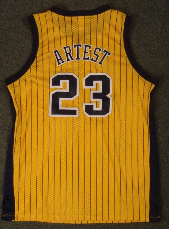 Authentic Indiana Pacers Ron Artest Jeresey Basketball: Here is an authentic Indiana Pacers Ron Artest jersey. It is all yellow with blue pin-stripes and writting. The jersey is from Reebok, sized 52. It is in excellent condition. A