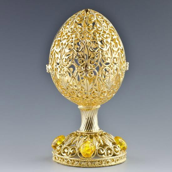 Rising Cross Faberge Egg: Rising Cross Faberge Egg, Dimensions: 5in (H) X 2.5in (D), Material: Pewter. The famed Faberge eggs are jeweled eggs, often with the most ornate, minuscule designs on them. The House o