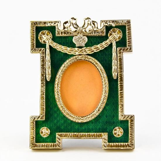 Green Enameled Faberge Frame: Green Enameled Faberge Frame , The photo frame is in two color gold-mounted green enamel surrounded by a crystal set ribbon tie suspended by a laurel garland. The frame's edges are covered with go