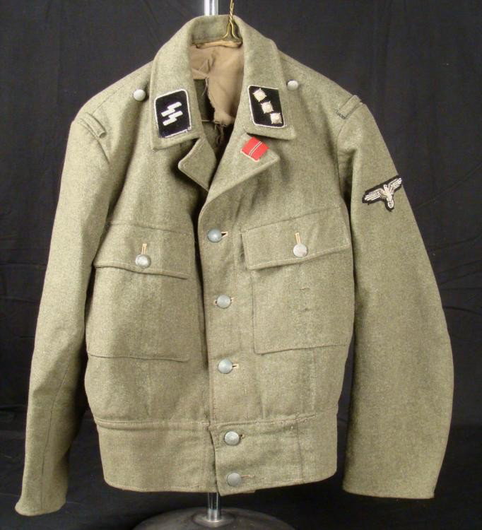 WWII Nazi Late War Period Army Uniform Coat: Here is a Nazi Uniform Coat of the late WWII period. It is green wool with tan cotton lining. The silver tone pebbled buttons are marked E. & Co. L on back. The lining is stamped with several numbers,