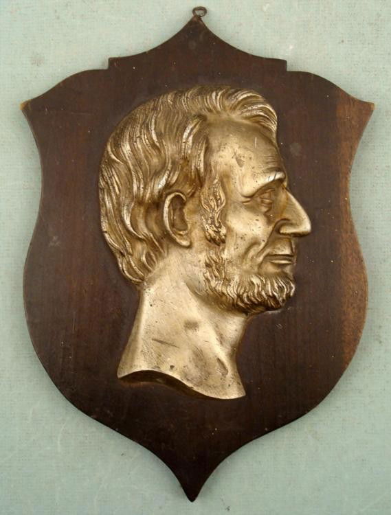 Vintage Abraham Lincoln Presidential Wall Plaque: Here is Abraham Lincoln's head in raised profile on a terrific wall plaque. It the head is fairly heavy silver tone metal with nice details. The plaque is wood and it looks like it was custom made, wi