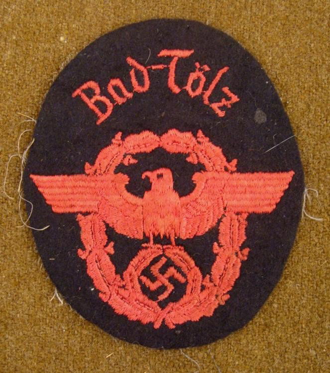 WWII NAZI FIRE POLICE SLEEVE PATCH FROM BAD-TOLZ: OFFERED HERE IS A WWII, NAZI FIRE POLICE SLEEVE PATCH FROM "BAD-TOLZ". IT IS CRIMSON RED ON A DARK WOOL BACKGROUND AND MEASURES OUT TO BE 3 1/4" X 3 3/4". * * *