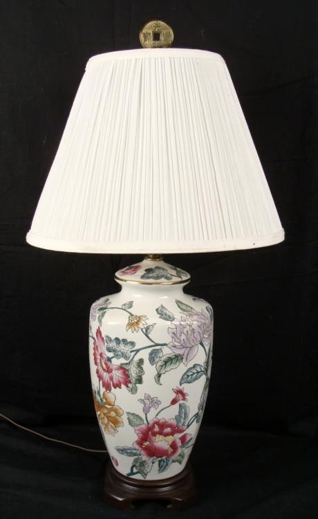 Kaiser Kuhn Chinese Porcelain Floral Table Lamp: This lamp has a porcelain base with colorful Chinese floral motif, with gold trim. The base is wooden, also in an Oriental style. The finial is designed like a Chinese coin. It is in working condition