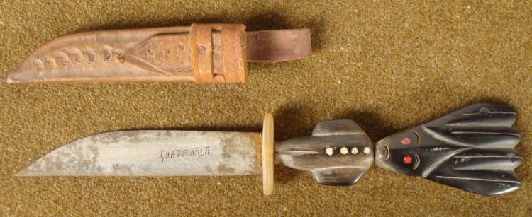 HAND MADE KNIFE GUATEMALA PRIMITIVE FIGURE HANDLE: HERE IS A NICE, OLD, ONE OF A KIND HAND MADE KNIFE. THE HANDLE APPEARS TO BE OF A PRIMITIVE FIGURE. THE WORD GUATEMALA IS ENGRAVED ON THE BLADE. THE CROSS GUARD APPEARS TO BE MADE OF