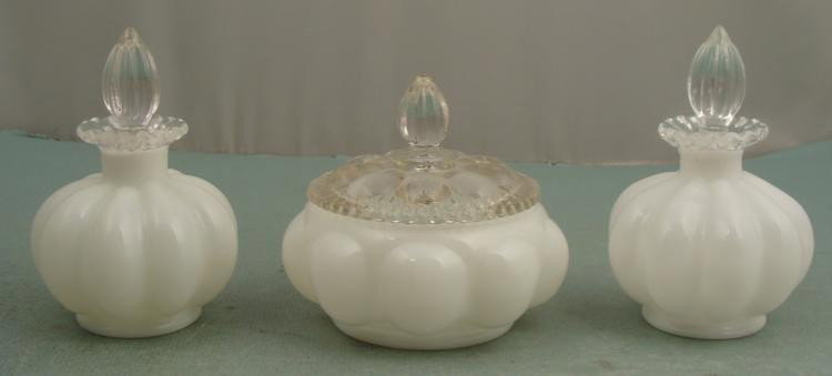 Fenton Glass 3 Pc White Melon Vanity Set 1940s: This 3 piece Vanity Set was made by Fenton in the 1940's. It is in the White Melon color, and includes two perfume bottles and one powder jar. The are complete with clear glass stoppers and lids. * Co