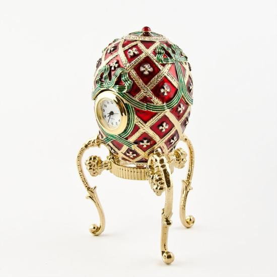 Order of St. George Faberge Egg: Order of St. George Faberge Egg. Material: Pewter, Crystals, Enamel. Dimensions: 4.5in (Height with Stand, 3in Without Stand) X 2in (Egg Diameter) The famed Faberge eggs are jeweled eggs&#