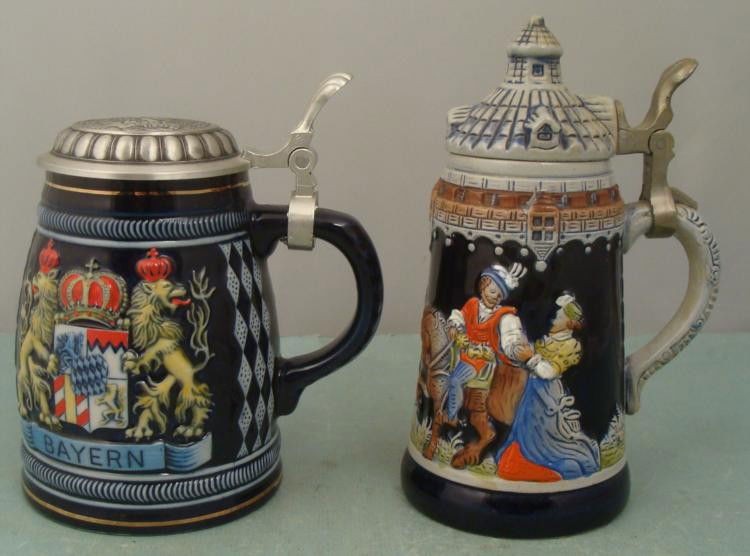 2 German Beer Steins Disney World & King West Germany: Here are two German beer steins, each in a different distinctive shape. * One is a Domex made in Germany, and it was originally purchased at a Disney resort. It is ceramic with pewter lid, and feature