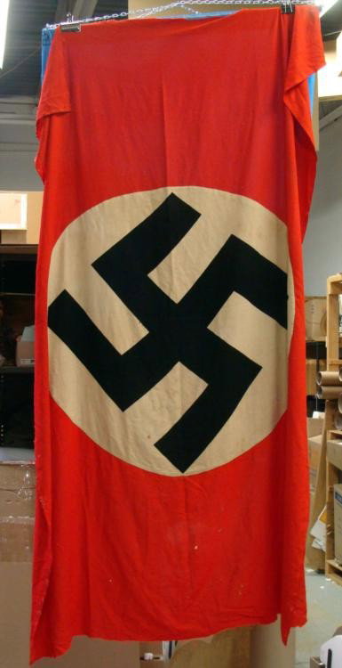 WWII Nazi Germany Flag with Swastika-Ripped Off Balcony: This is a WWII era Nazi Germany flag or banner, brought back from an American G.I. The soldier ripped it off a balcony and carried it proudly home. This accounts for the torn portion at the top, and o