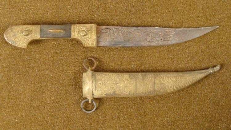 OLD SYRIAN HAND COMBAT DAGGER DOUBLE HAND ENGRAVED: OLD SYRIAN HAND COMBAT DAGGER-QUALITY ELABORATE PIECE-DOUBLE HAND ENGRAVED BLADE * NICE HAND TOOLED GRIP FITTINGS, POMMEL AND LOWER SECTION--CENTER IS WOOD--6 1/4", UPWARD CURVED BLADE WITH HAND CARVI