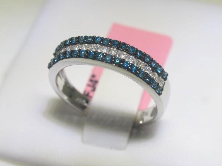 .33 CT Blue Diamonds and .23 CT Diamonds 14K WG Ring: Blue Diamonds and Diamonds 14K White Gold RingTotal Weight of 15 Round cut Diamonds - 0.23 CTTotal Weight of Blue Diamonds - 0.33 CT14K White Gold - 2.70 gramsAppraised Value: $ 3,792.00