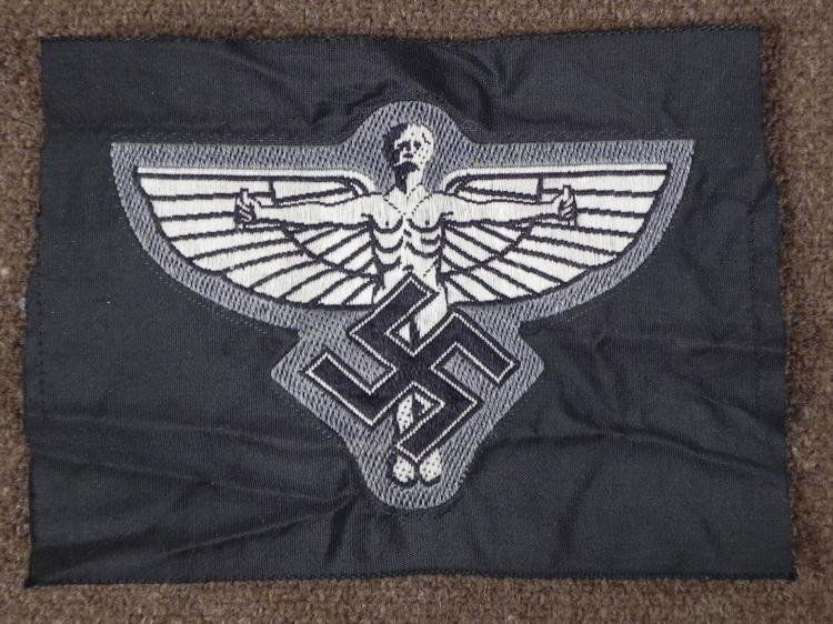 ORIGINAL NSFK-UNIFORM INSIGNIA WWII NAZI PATCH: OFFERED HERE IS A NSFK-UNIFORM INSIGNIA NAZI PATCH. ON THE FRONT THERE IS A EARLY FLYING ASSOCIATION NSFK MAN WITH A SWASTIKA. * * * *