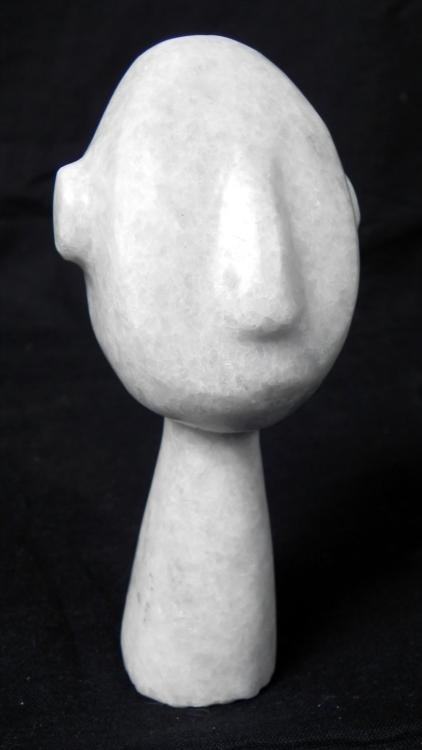 Antique Hand-Carved Marble Head Figure -Africa, Island: This hand-carved marble head is from a figure, probably from a primitive region of Africa, or surrounding islands. Its age is unknown, but it could be over 100 years old. It is 5" tall, with its long 