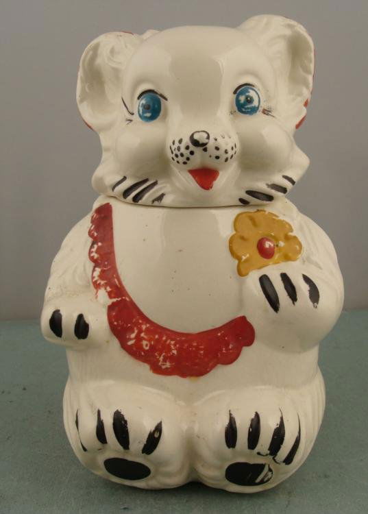 Royal Wear Vintage White Bear Cookie Jar Stoneware:  This big vintage White Bear Cookie Jar is ready to tempt you with its blue eyes, and charming flower. * * Condition: Good (there is a crack on the head, some glaze wear and minor crazing)Size of