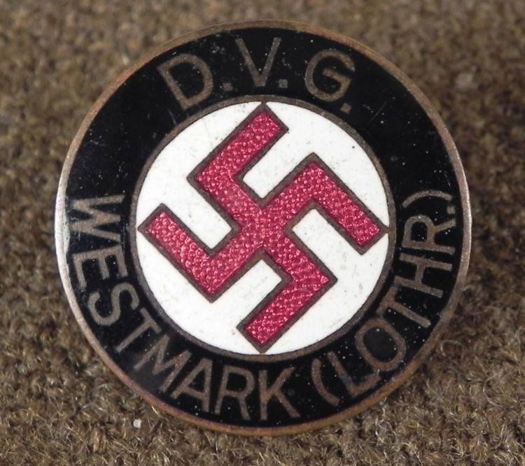 RARE BADGE FOR THE FEDERATION OF GERMAN ETHNIC GROUPS: OFFERED HER IS A RARE ORIGINAL BADGE FOR THE FEDERATION OF GERMAN ETHNIC GROUPS; WESTMARK (ALSACE-LORRAINE). THE ENAMEL HAS A BLACK BORDER WITH A WHITE CENTER AND A RED SWASTIKA IN THE CENTER.&n