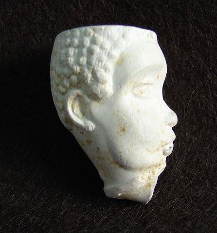 Early Clay Pipe depicting the head of Southern Slave: Early Clay Pipe depicting the head of Southern Slave during the 1840 to 1860 period. This pipe was unearthed at a tavern site in South Carolina and were most probably cast in the south and given to bi