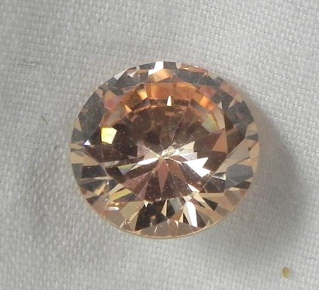 5.88 Ct. Natural Zircon Champagne Round Gemstone: Gem Type: Natural ZirconTotal Carat Weight: 5.88 Ct.Color: Champagne Shape: Round Quality: High quality, with excellent cutting, clarity, and luster