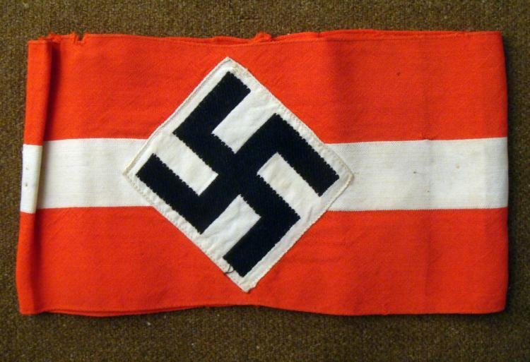 ORIGINAL HITLER YOUTH ARMBAND WORN BY A HJ MEMBER: THIS IS AN ORIGINAL HITLER YOUTH ARMBAND THAT HAS BEEN SEWN TOGETHER & WAS WORN BY A HJ MEMBER. THE ARMBAND IS RED WITH A WHITE CENTRAL STRIPE AND A DIAMOND WITH A SWASTIKA. *