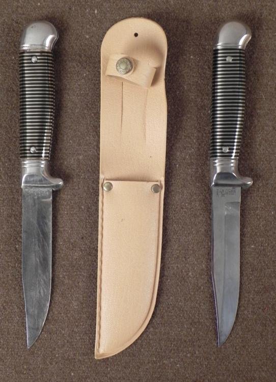 TWO IMPERIAL VINTAGE FIXED BLADE KNIVES: 2 IMPERIAL VINTAGE FIXED BLADE KNIVES. ONE OF THE KNIVES COMES WITH A SHEATH AND THE OTHER DOES NOT. THE KNIFE WITH A SHEATH IS IN EXCELLENT CONDITION, WITH AN OVERALL LENGTH OF 9". 