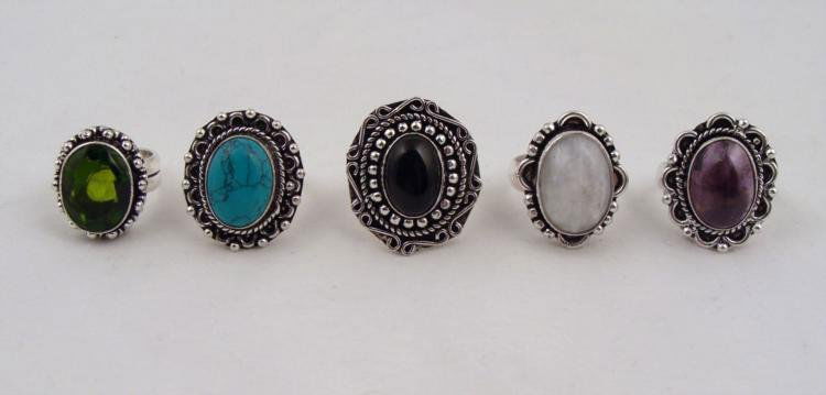 5 Sterling Rings Peridot Black Onyx Rainbow (Moonstone): 5 Gemstone Rings, with decorative sterling silver settings featuring curved and beaded patterns * All in excellent condition.PeridotCabashon AmethystBlack OnyxRainbow (Moonstone)Turquoise