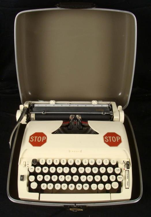Vintage Sears Citation 1906s Portable Typewriter w/Case: This is a vintage Sears Citation Portable Typewriter in the original case. This model is cream colored with gray interior, and black case exterior. It was made in the 1960's. It is in very good condit