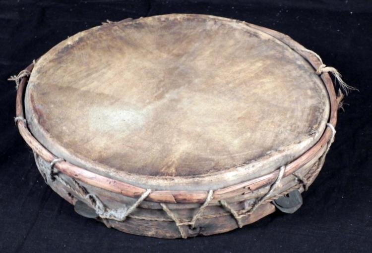 Haitian Voodoo Drum Authentic Vintage 1970s: Here is a Haitian Voodoo or Vodou Drum, used in ceremonies. These Vodou rites are done to call upon spirits. The drum has an animal hide skin, wooden edge tied with rope, and metal disks like a tambou