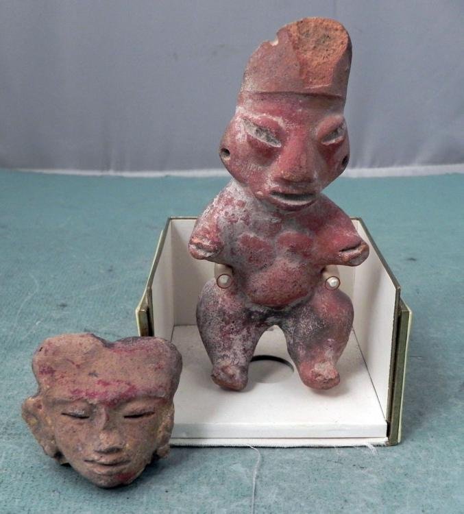 2 Ancient Antique Hand-Carved Clay Figures, Head: These are two hand-carved clay pieces, probably from a primitive region of Africa. Their age is unknown, but they might be ancients. One is a standing male figure 5 1/2" tall, with short arm. It is di