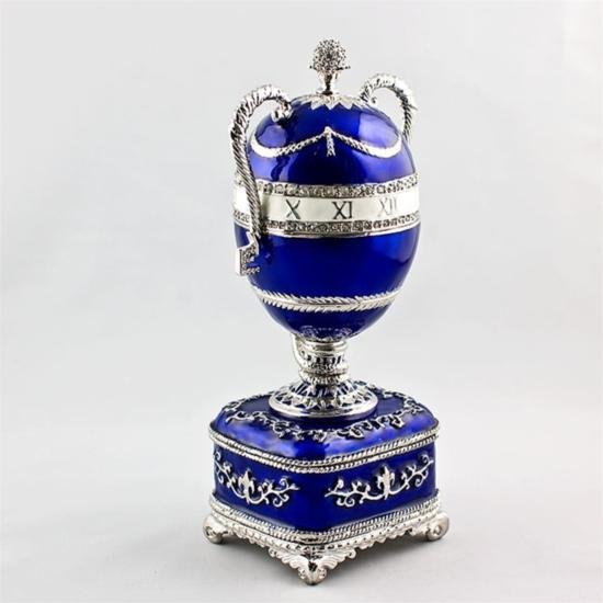 Blue Serpent Clock Faberge Egg: Blue Serpent Clock Faberge Egg, Dimensions: 6in (H) X 2in (W), Material: Pewter, Enamel, Crystals, The Blue Serpent Clock Egg is made of varicolored gold, diamonds and transluc