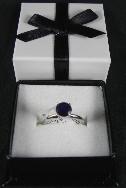 1.05 Carat Sapphire 14K White Gold Ring: This alluring lady's sapphire ring is set in a 14K white gold band and comes in its original box. * Gold content: 14K Style: Solitaire CutSapphire: l.05 CTClarity: AA-AAA * Condition: Excellent