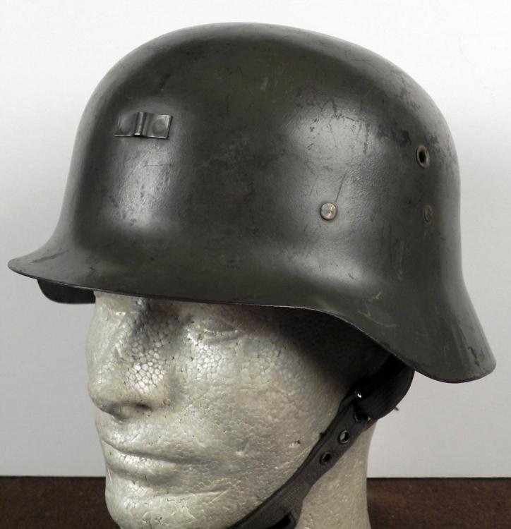 GERMAN TYPE M42 COMBAT HELMET WITH LINER AND CHINSTRAP: HERE IS A GERMAN RAW EDGE TYPE M42 COMBAT HELMET WITH LINER & CHINSTRAP. THE CHINSTRAP IS THE DOUBLE CHIN TYPE PARATROOPER STRAP. THE HELMET IS IN GOOD CONDITION * * *
