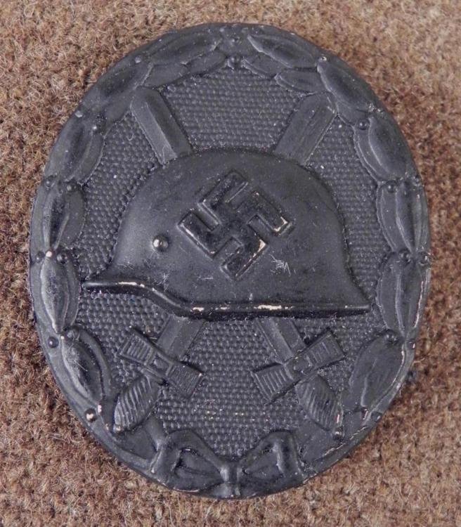 NAZI BLACK WOUND BADGE-CLEAN ORIGINAL HARD TO COME BY: NAZI BLACK WOUND BADGE-CLEAN ORIGINAL-CROSSED SWORDS, HELMET & SWASTIKA * NICE HARD TO COME BY CLEAN ORIGINAL *