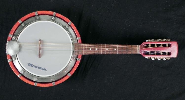 Musima 8 String Vintage Banjo East Germany: This is a vintage Musima 8 string banjo, measuring 24" long with an 10 3/8" diameter body. It appears to be in excellent condition overall, and has a nice sound, just in need of a tuning. The skin has