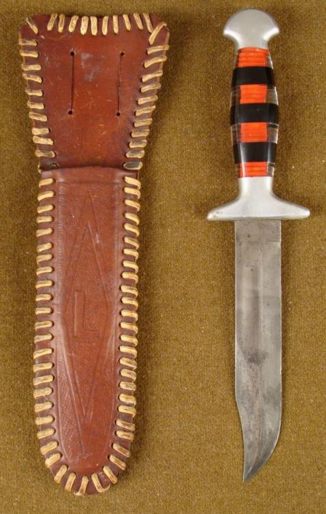 WWII PACIFIC MARINES BOWIE TYPE FIGHTING KNIFE W/SHEATH: WWII PACIFIC MARINES BOWIE TYPE FIGHTING KNIFE W/LEATHER SHEATH-ID'D ON BACK * GREAT HISTORICAL FIGHTING KNIFE--LUCITE LAYERED GRIP=BOWIE KNIFE BLADE--SHEATH IS HARD SHELL LEATHER--RAWHIDE AROUND EDGI