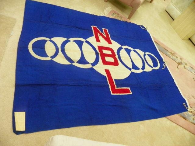 JAPANESE 1936 NIPPON BASEBALL LEAGUE BANNER-5X7 BERLIN: AN HISTORICAL PIECE OF JAPANESE BASEBALL, THE 1936 BERLIN OLYMPICS AND THE POST WAR OSAKA BASEBALL STADIUM. THIS LARGE BANNER APPROXIMATELY 5X7 FEET IS PRIMARILY DARK BLUE WITH WHITE AND RED. THERE AR