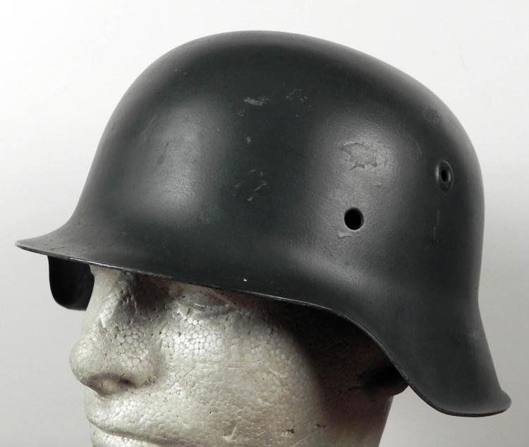 ORIGINAL NAZI M42 COMBAT HELMET: ORIGINAL NAZI M42 COMBAT HELMET, WITH RAW EDGE. IT IS LACKING A LEATHER LINER AND ATTACHMENT RIVETS. "ET64" AND "1624" ARE BOTH STAMPED ON THE INSIDE. THIS HELMET