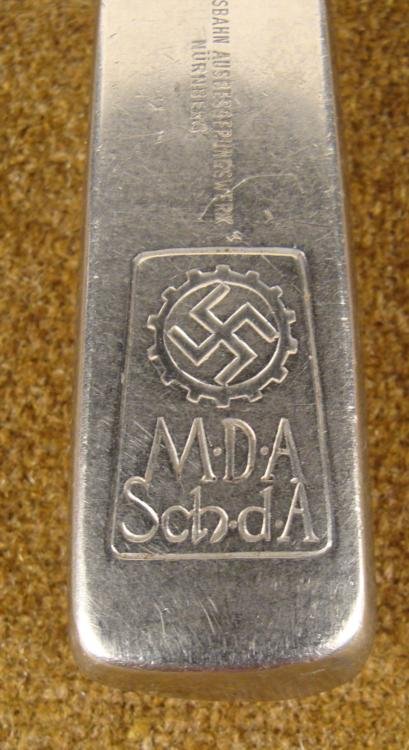 ORIGINAL NAZI DAF DINING HALL KNIFE WWII: THIS IS AN ORIGINAL NAZI DAF DINING HALL KNIFE SPEARPOINT * * THE HANDLE HAS A DAF/DEUTSCHEN ARBEIT FRONT GEAR & SWASTIKA. UNDERNEATH THE SWASTIKA IT READS: "M.D.A SCH D A---REICH