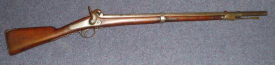 ET0503120094 A 19th Century Belgian Percussion Cap Carb: ET0503120094 A 19th Century Belgian Percussion Cap Carbine, the 75cm steel barrel stamped ID 8324, plain steel lock, walnut two band stock, the butt stamped 2183 and S.Y./127, with